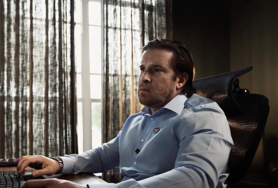 Joshua Nelson working at his desk